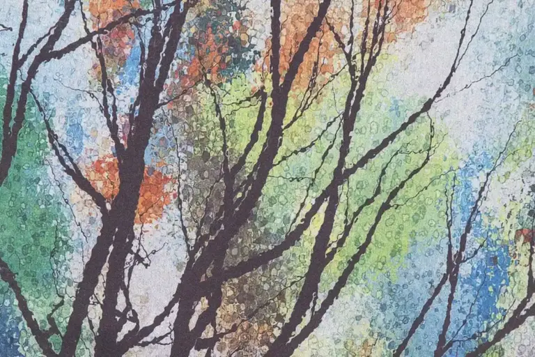 Abstract watercolor-style image of tree branches with a colorful, multicolored background.