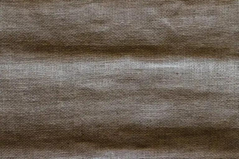 Close-up view of a brown woven fabric with visible fibers