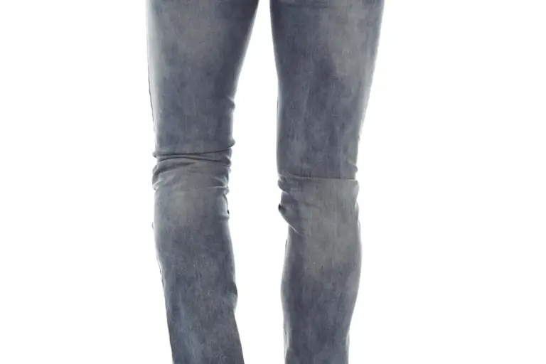 Full-leg view of blue denim jeans, highlighting the cotton fabric and twill weave.