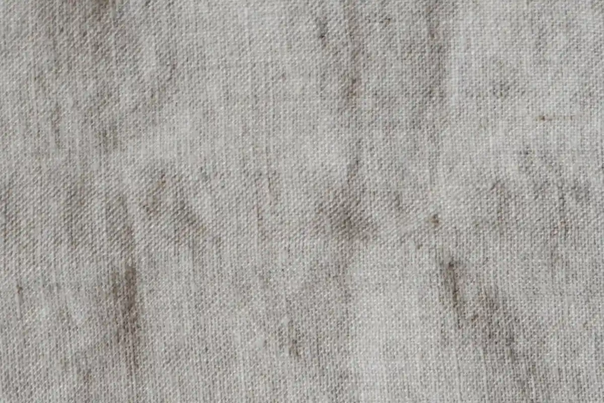 Close-up linen fabric texture showing the natural weave and fibers