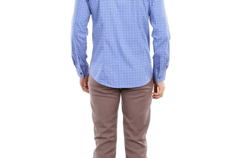 Person shown from behind wearing a light blue patterned long-sleeve shirt and brown pants.