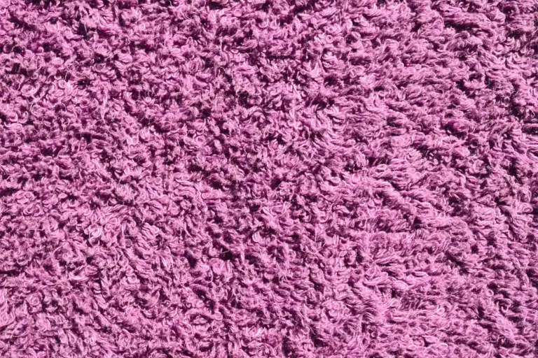 Macro close-up of purple plush fabric texture