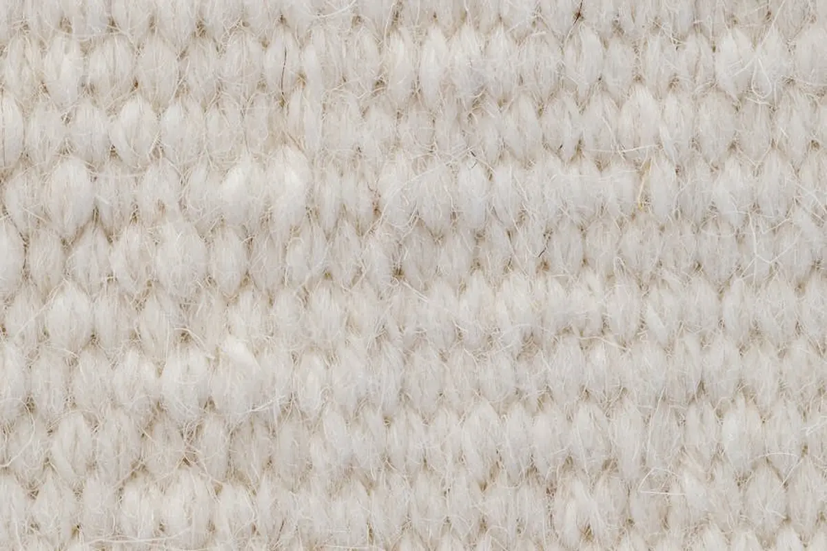 Beige nylon fabric fibers in a woven/knit texture