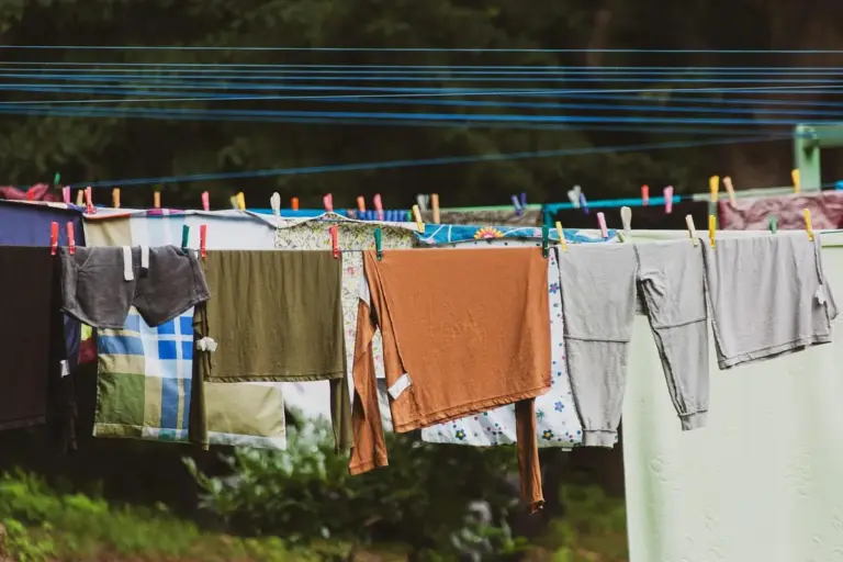 Clothes hanging on a clothesline outdoors, drying in the sun.