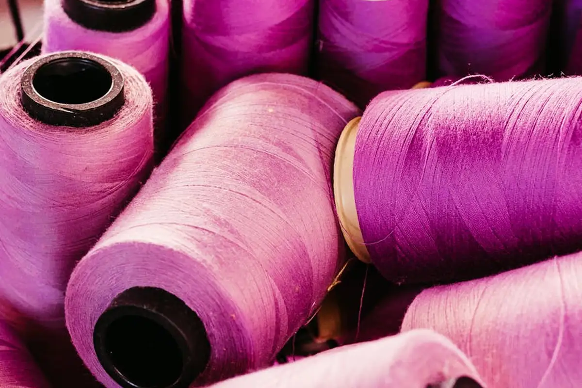 Close-up of pink nylon thread spools