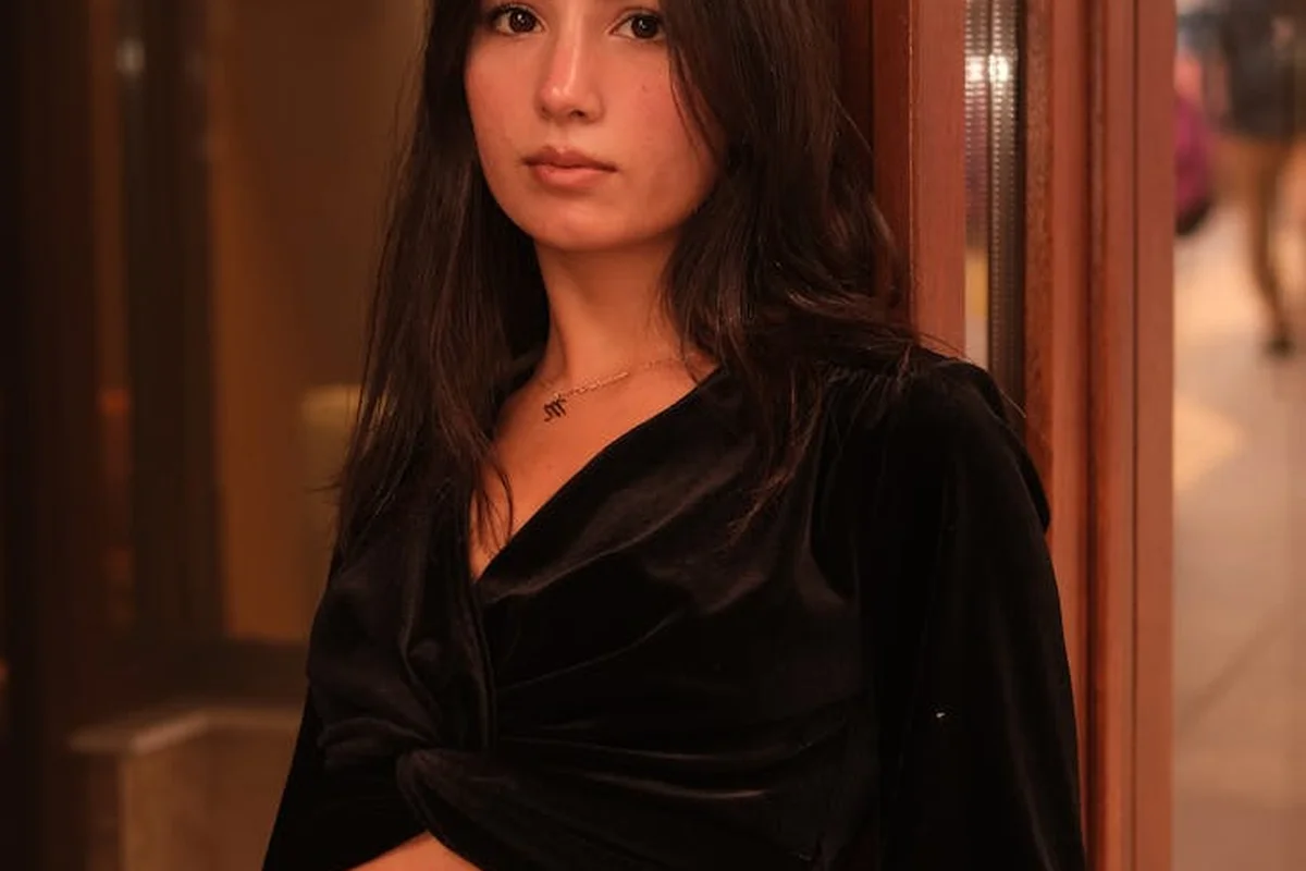 Portrait of a woman wearing a black velvet top