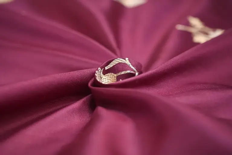 Macro shot of rich purple rayon fabric with soft folds and subtle sheen