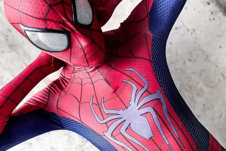 Close-up of a red and blue Spider-Man spandex suit with a black web pattern.