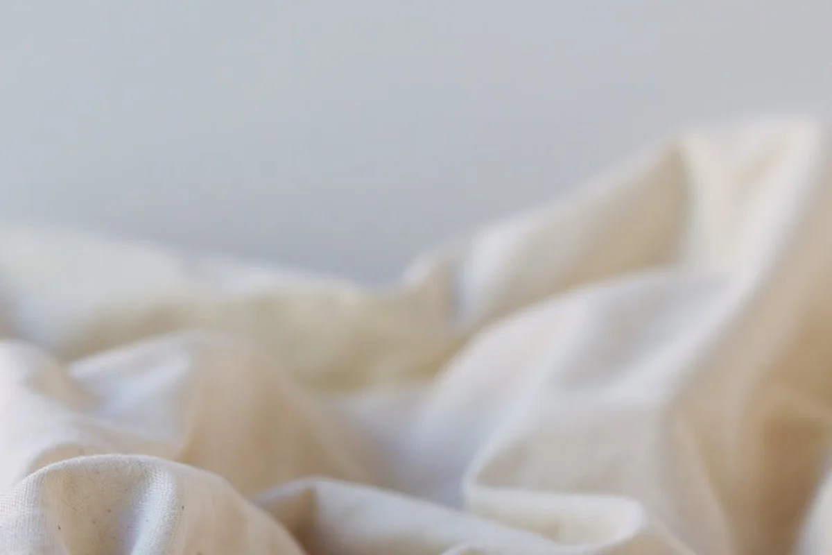 Close-up of soft white viscose fabric with gentle folds